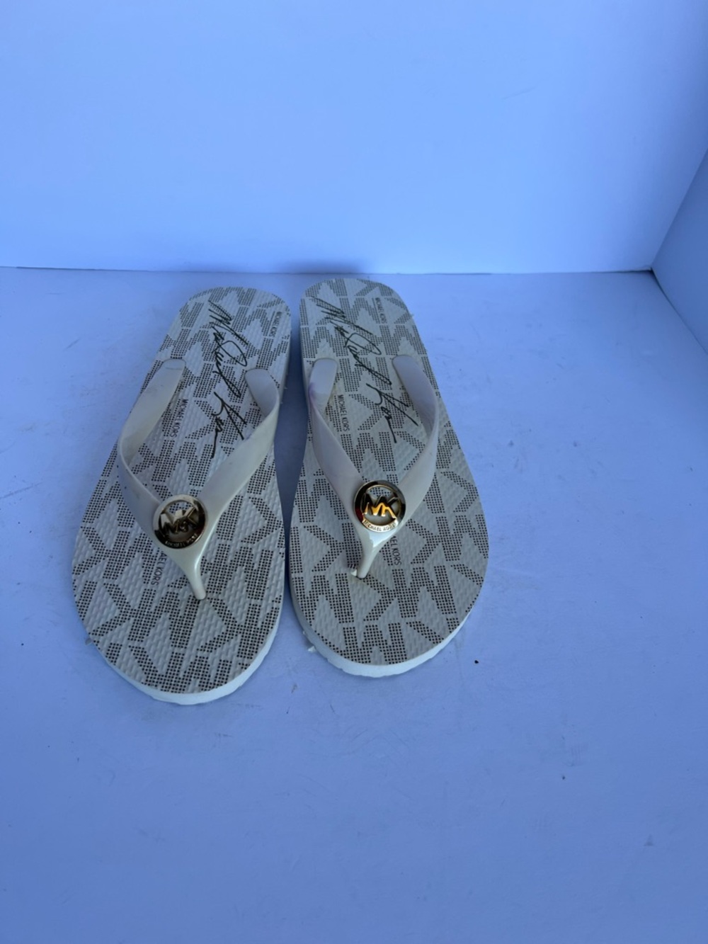 Michael Kors Cream Logo Thong Sandals with Gold Medallion